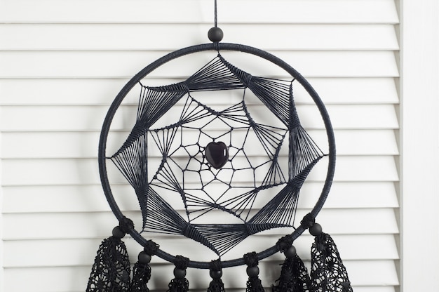 Photo black dream catcher with crocheted doilies