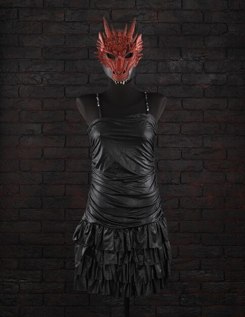 black dress and dragon mask