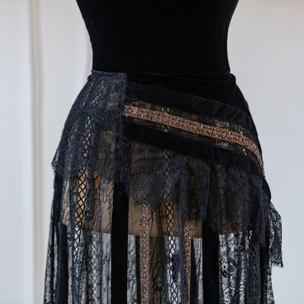 Photo a black dress with a lace skirt on it