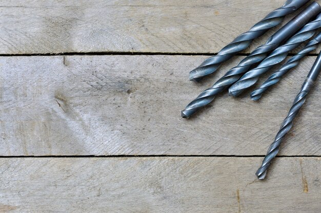 Black drill on wooden table