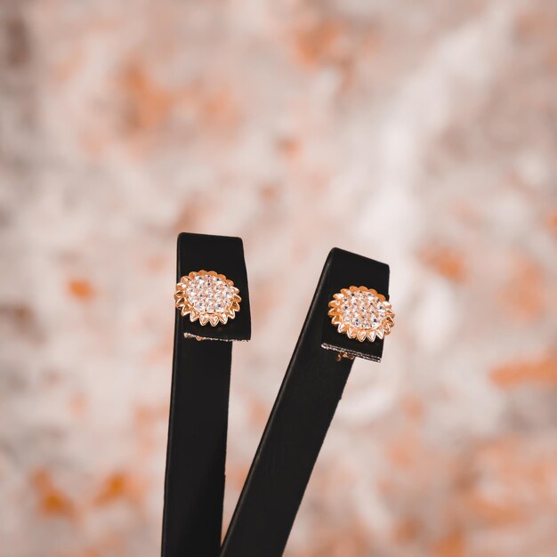 Black earrings with the word diamond on the front.