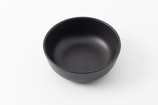 Black empty ceramic bowl isolated on white background.