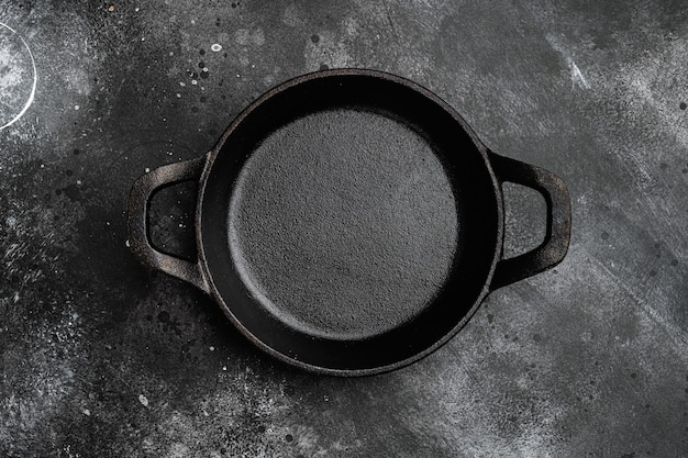 Black Empty clay pot set with copy space for text or food with copy space for text or food, top view flat lay, on black dark stone table background