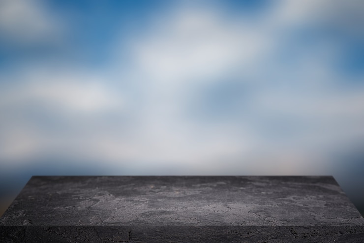 Photo black empty stone surface against blue sky in afternoon