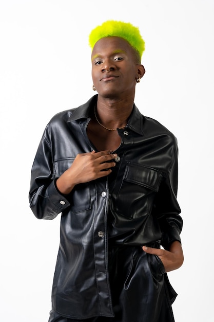 Black ethnicity man in studio with white background LGTBI concept fashion posed with black jacket