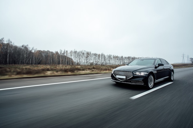 Black Executive car in motion