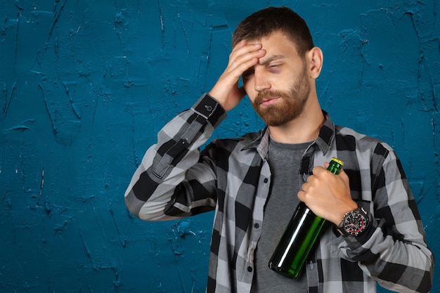 Black eyed loser with beer bottle