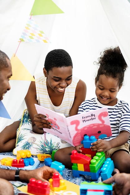 Black family enjoying summer together at backyard