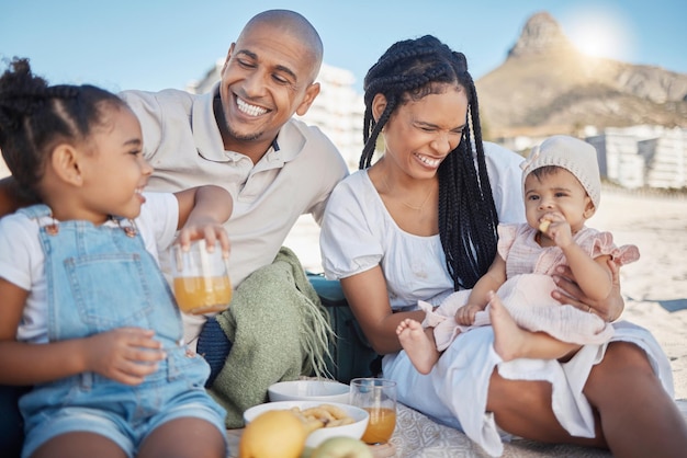 Black family happy and food picnic on beach with kids to enjoy summer outing together in Cape Town South Africa Children mother and dad relax on sand in nature for bonding in sunshine