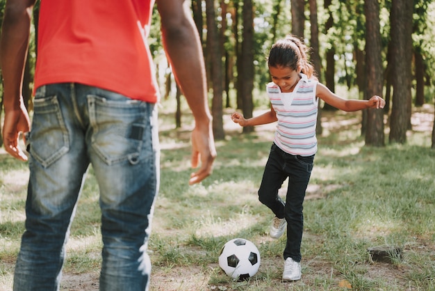 Black Father Is Playing Football With Daughter.