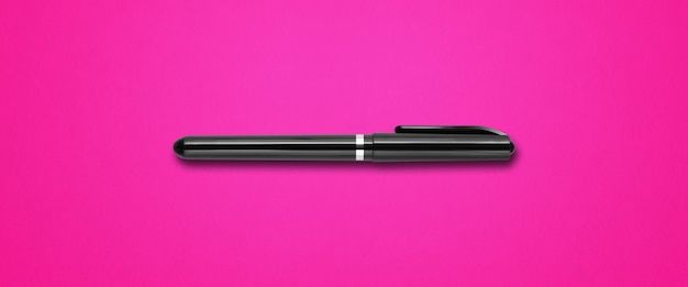 Black felt pen isolated on pink banner background