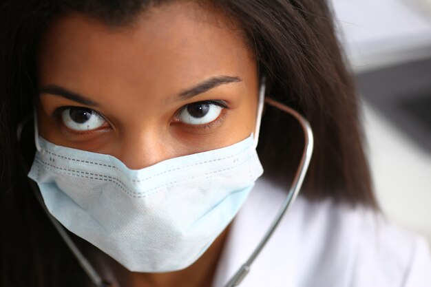 Black female doctor in a face mask