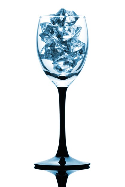 Black footed tumbler with ice cube on the white background in blue key