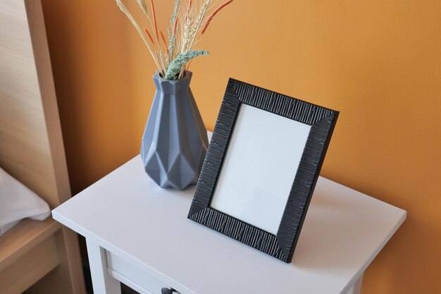 Black frame mockup in a living room