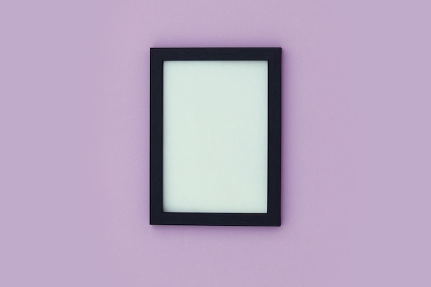 Photo black frame with a white surface on a purple background