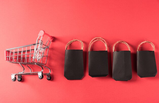 Black friday sale black shopping bags and shopping cart