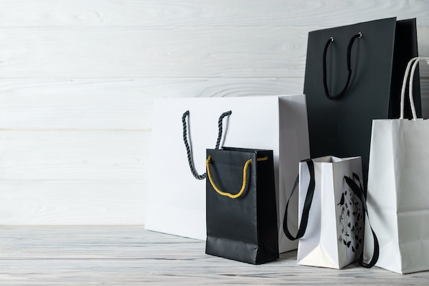 Black friday sale composition with black and white paper bags. 