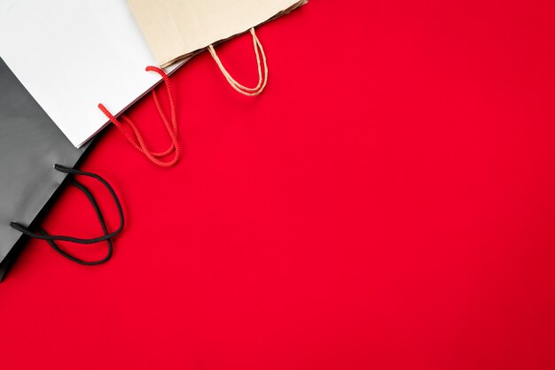 Black friday sale, shopping bag on red background