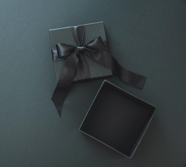 Black friday sale template gift box open with ribbon\
overhead