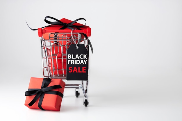 Black friday shopping cart with red gift box