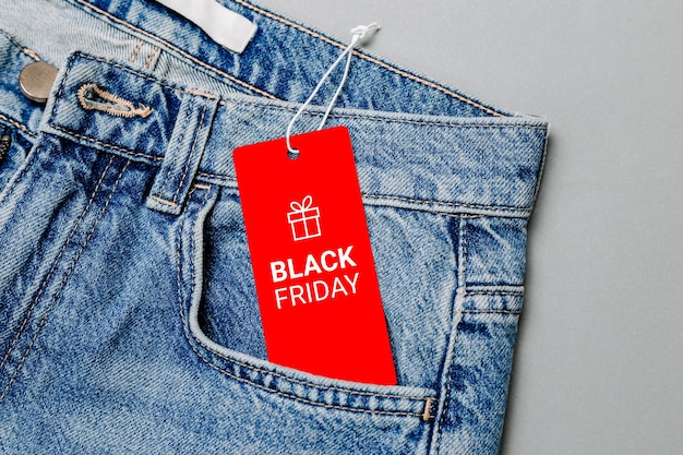 Black Friday text on a black tag in jeans pocket