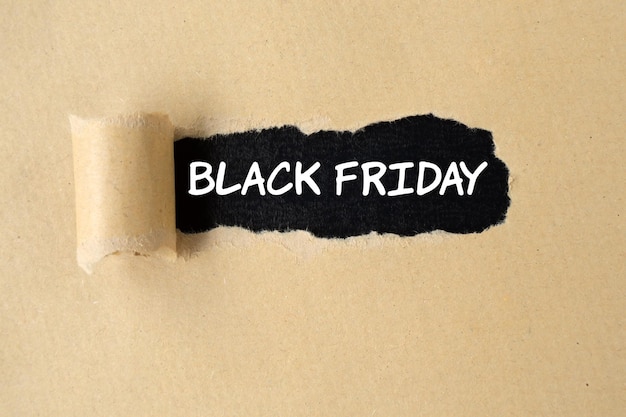 Black Friday text on torn paper