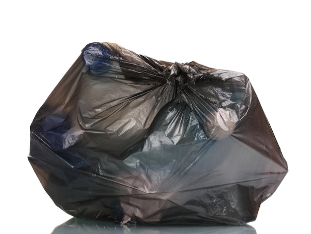 Photo black garbage bag with trash isolated on white