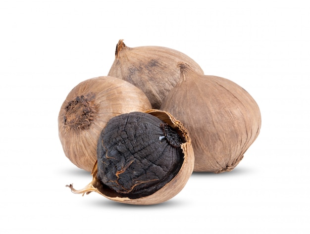 Black garlic bulbs isolated on white