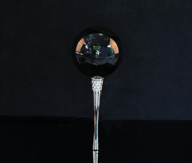 black glass ball in black oil