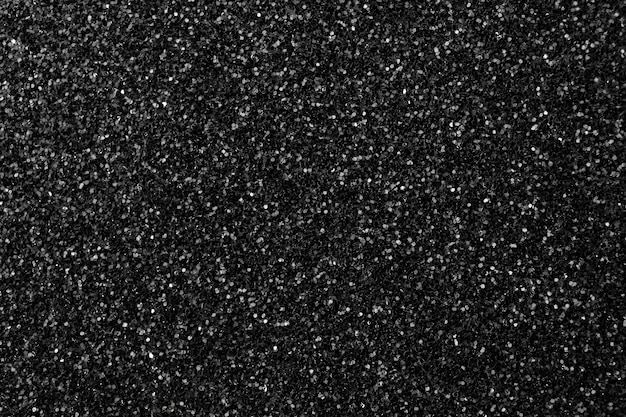 Foto sfondo texture glitter nero, superficie alta dettagliata glitter o sandpapper, foto di concetto di effetti luminosi brillanti
