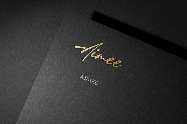 black and gold book cover with the name aie on it.