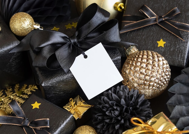 Black and golden Christmas Gift Boxes and ornaments square gift tag Mockup