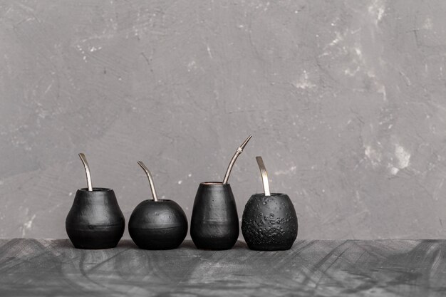 Photo black gourd with sipped metal straw