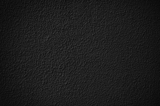 Photo black grainy plaster wall texture