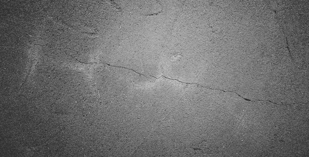 Black grainy stone texture backgroundor dark gray textured background