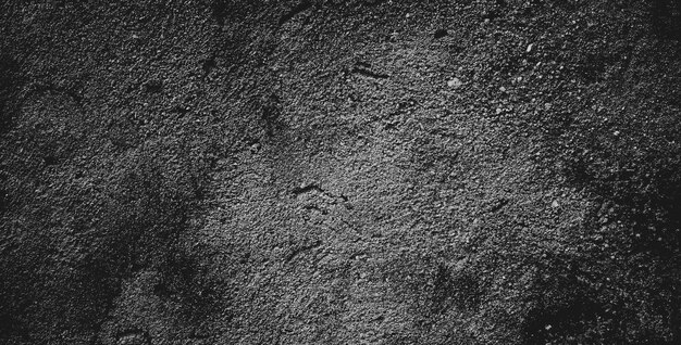 Black grainy stone texture backgroundor dark gray textured background