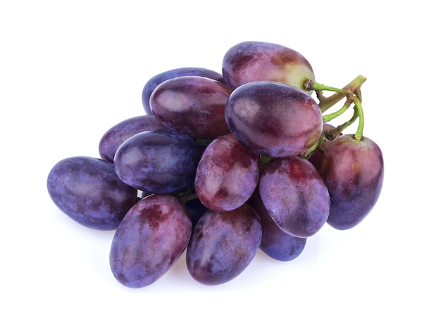 Black grape on white surface