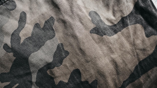 A black and grey camouflage fabric with a black background