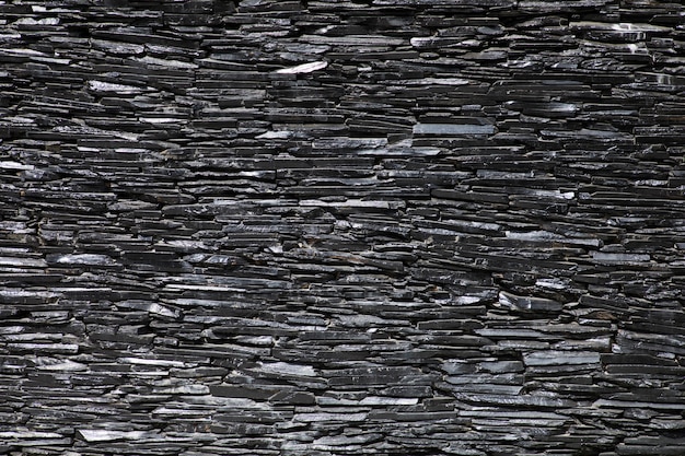 Black and grey Granite stones wall texture background