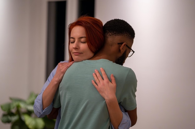 Black guy and girl hugging moment of strong feelings of love and friendship loving couple