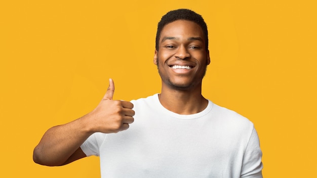 Black guy showing thumb up and smiling