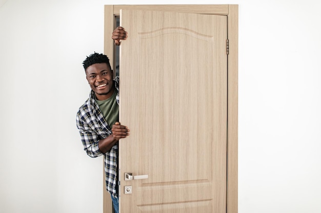 Black Guy Smiling Opening Entry Door Of New House