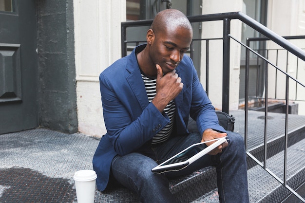 Black Guy Using Digital Tablet