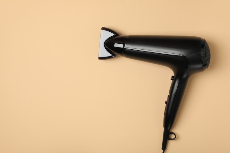 Photo black hair dryer, space for text