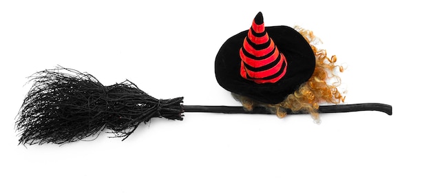 black halloween witchs broom on a white background