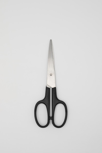 Black handled scissors isolated on white background