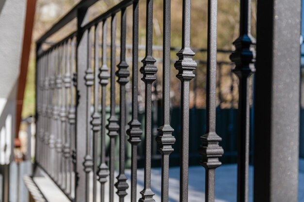 Black handmade metal railings with wrought iron elements