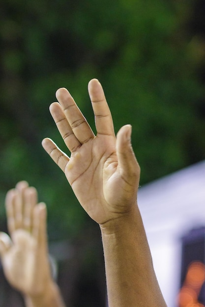 Black hands towards the sky in Rio de Janeiro Brazil