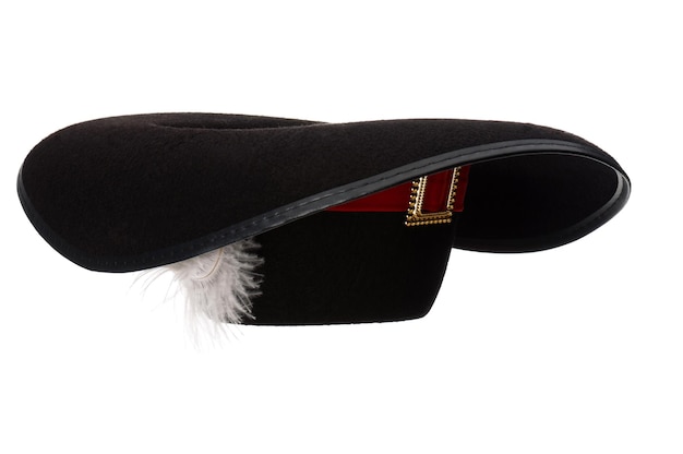 Black hat with feather and ribbon isolated on white background