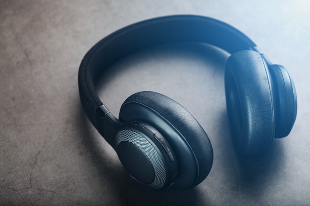 Black headphones on grey